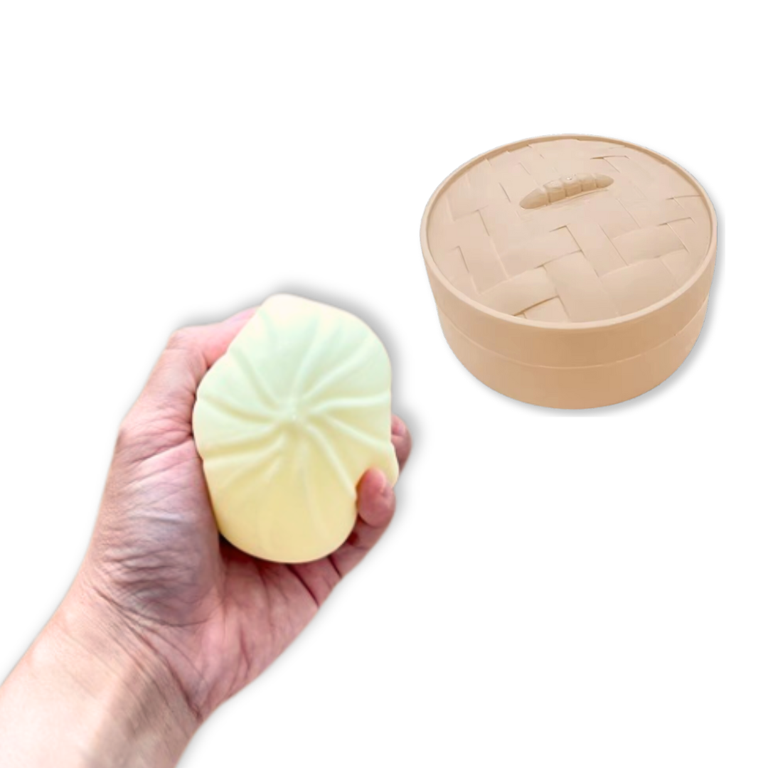 Image of hand squeezing cute squishy bao stress relief fidget toy