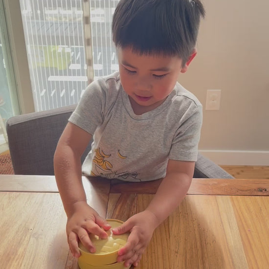 Video of kid playing with cute squishy bao stress relief fidget toy